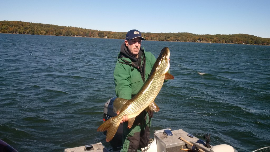Brian Fons with his 43 inch musky on Big Sand Lake